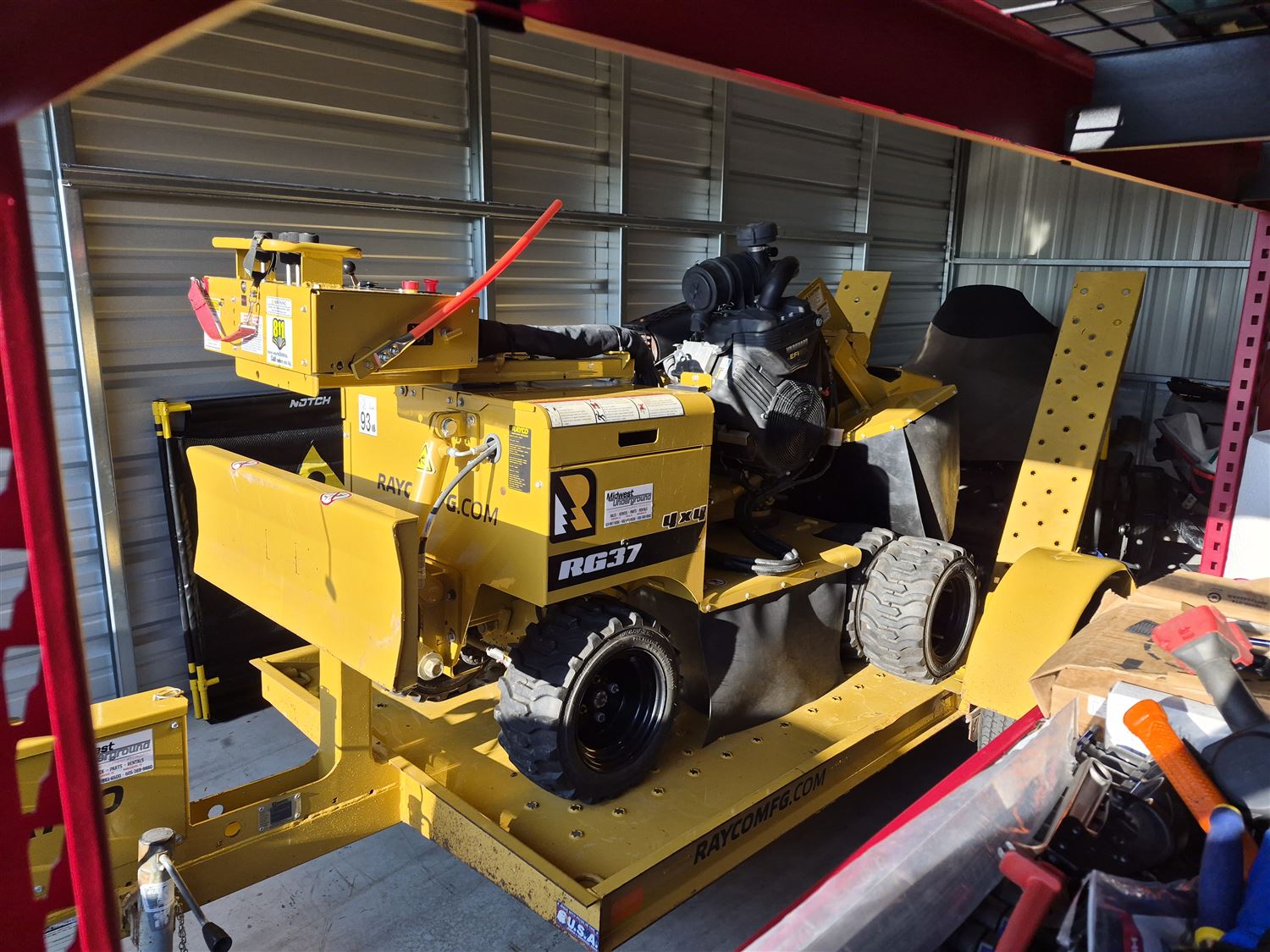 The Rayco RG37 4x4 stump grinder loaded on its trailer, ready to go out